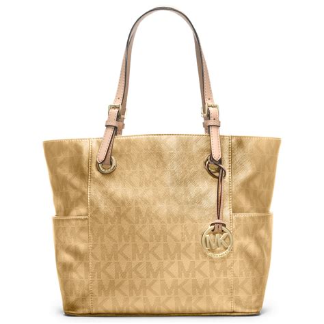 michael kors gold signature tote|Michael Kors voyager signature tote.